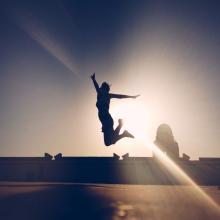 A man jumping on the Tel Aviv boardwalk