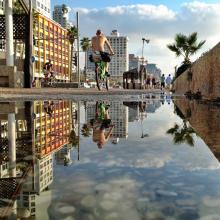 Cycling on the boardwalk near the Dan Tel Aviv Hotel